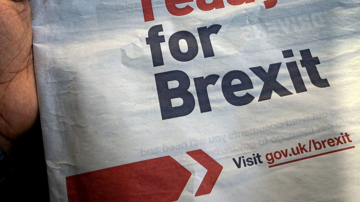 newspaper showing Brexit advert by UK government