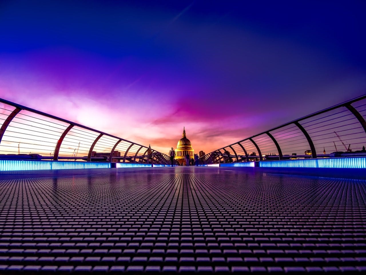 dramatic view of City of London and St Paul's cathedral from Millenium Bridge