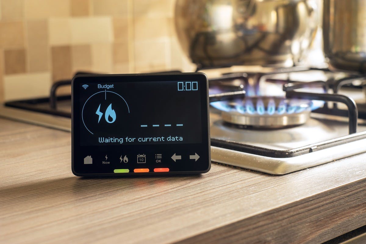 Picture of an energy smart meter on a kitchen counter.