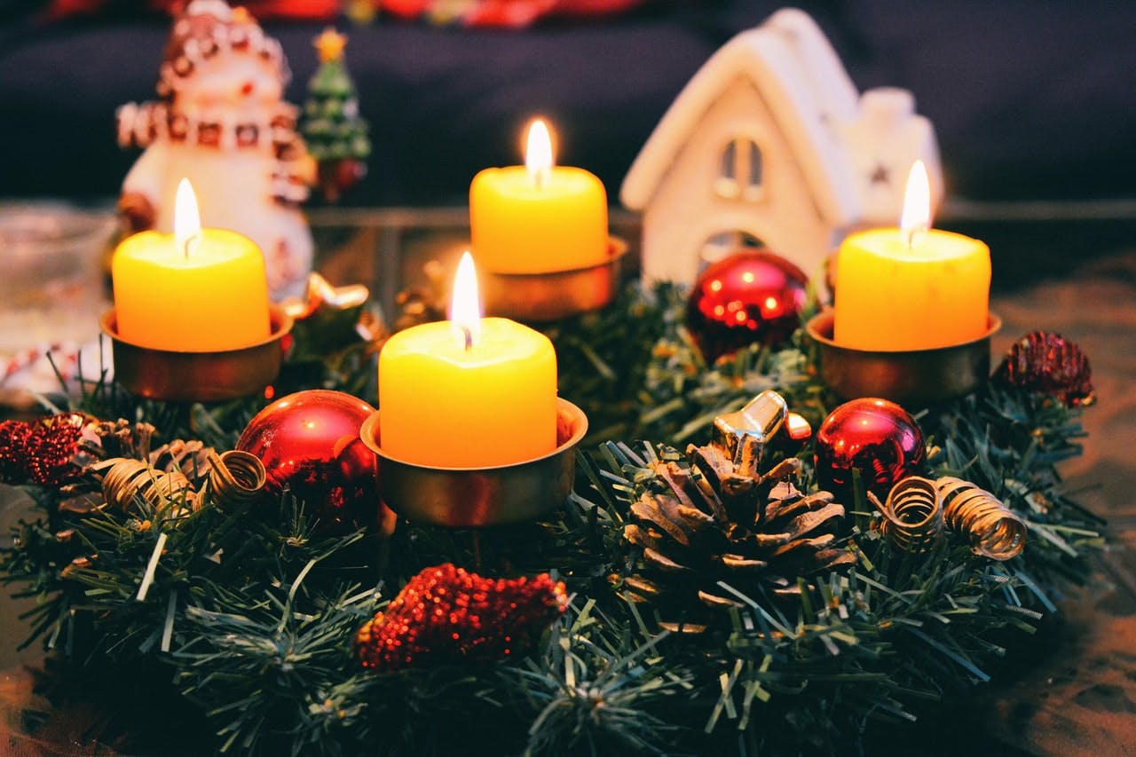christmas decorations and candles in a warm home
